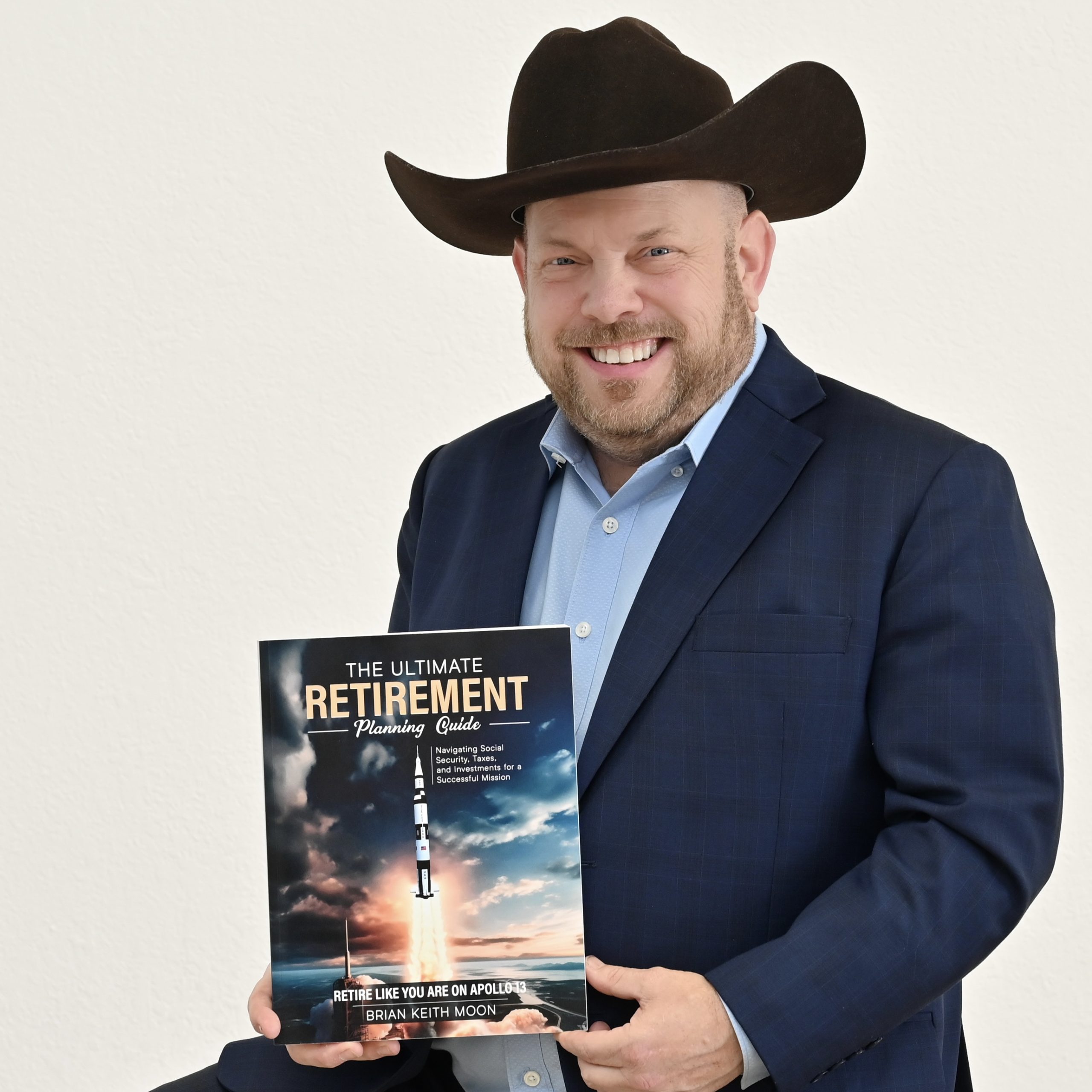 Toro Bravo Founder, Wealth Manager and Chief Compliance Officer Brian Moon holding hi book The Ultimate Retirement Planning Guide